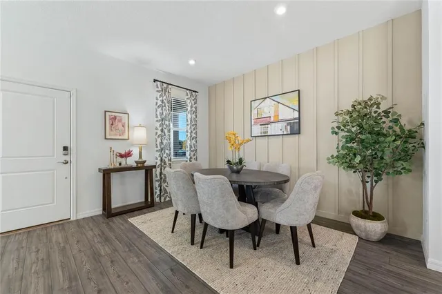 a view of a livingroom with furniture and a potted plant
