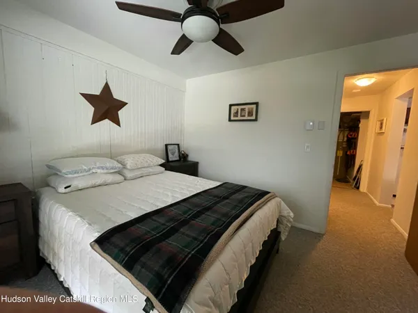 a bedroom with a bed and cabinets