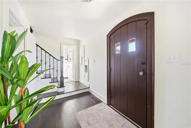 a view of an entryway with wooden floor