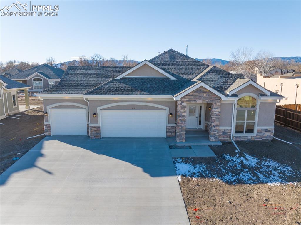 a front view of a house with garden