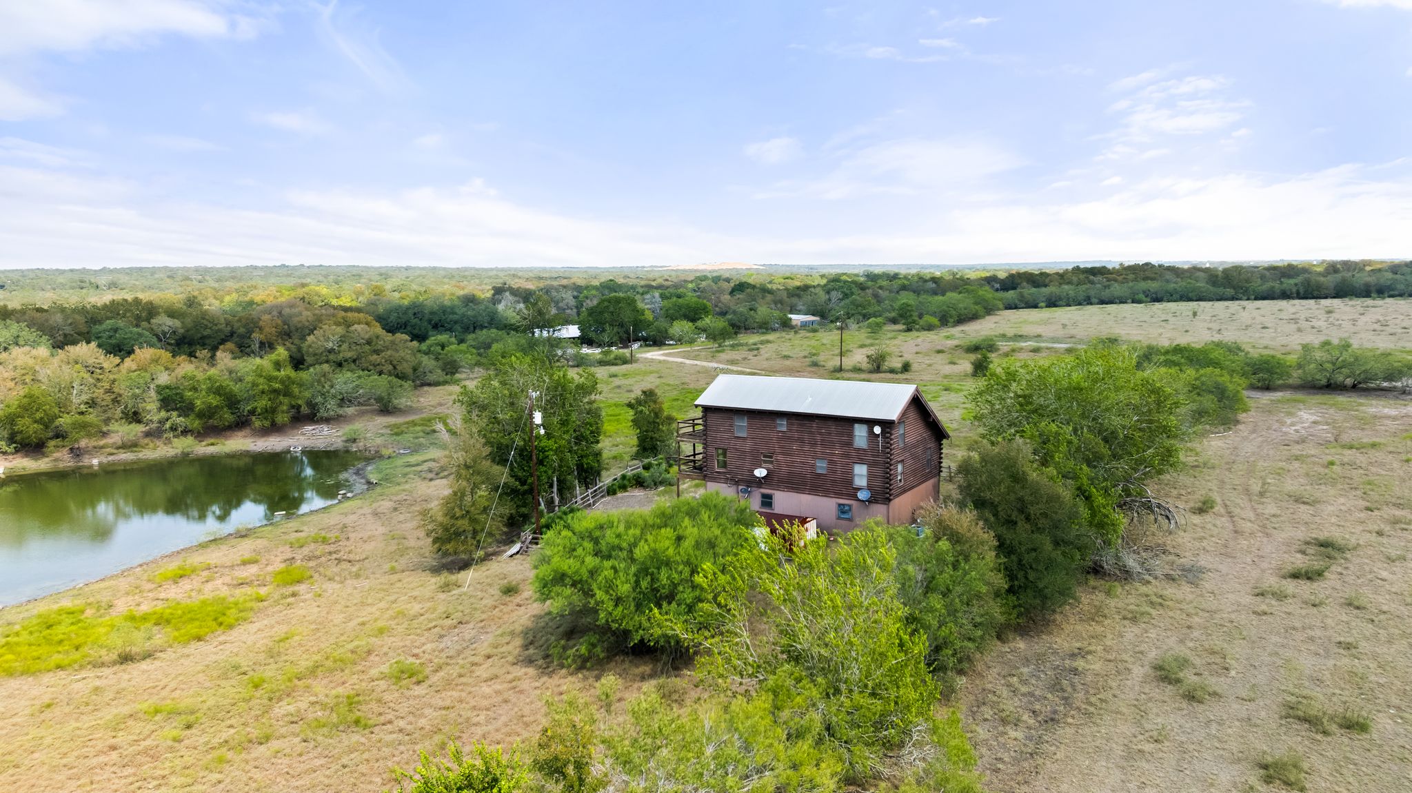 a aerial view of a house with a lake view
