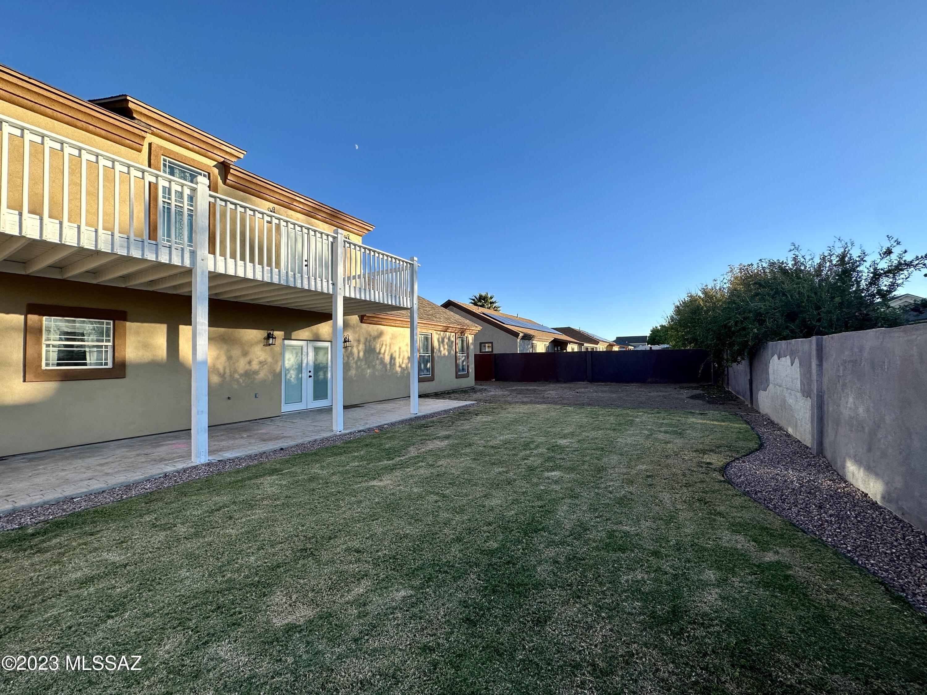 508 Eagle Meadow Loop Thatcher, AZ 85552 - Photo 28 of 32 a backyard of a house with lots of green space and outdoor seating