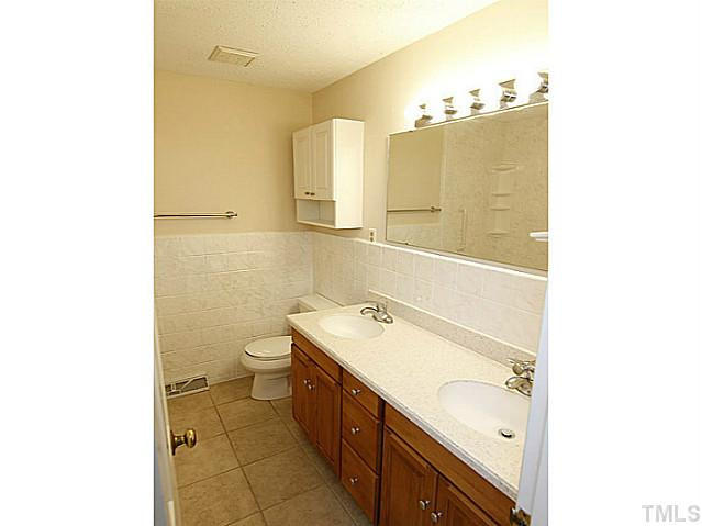 7605 Ligon Mill Road Wake Forest, NC 27587 - Photo 8 of 20 Hall Bath with Tile Floor, Dual Vanities and Tub/Shower. Bathroom