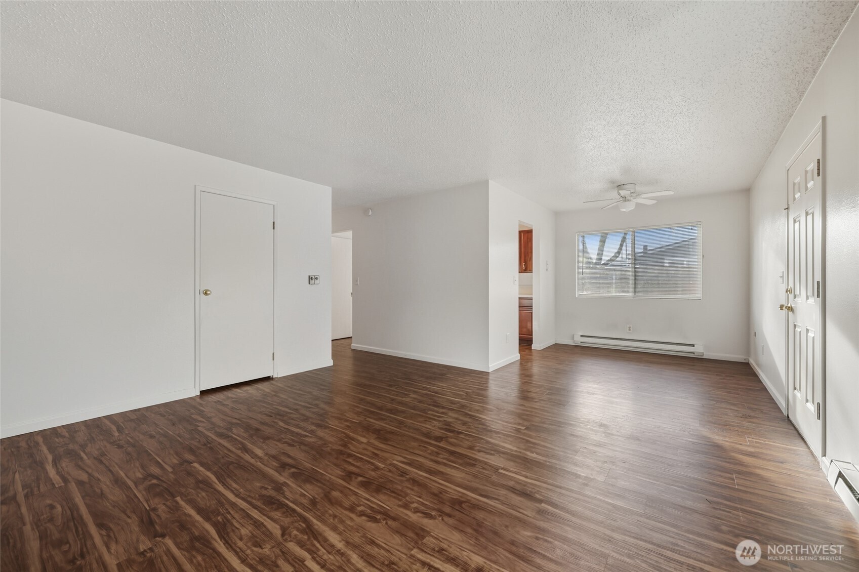 418 North 13th Street Elma, WA 98541 - Photo 11 of 34 wooden floor in an empty room with a window