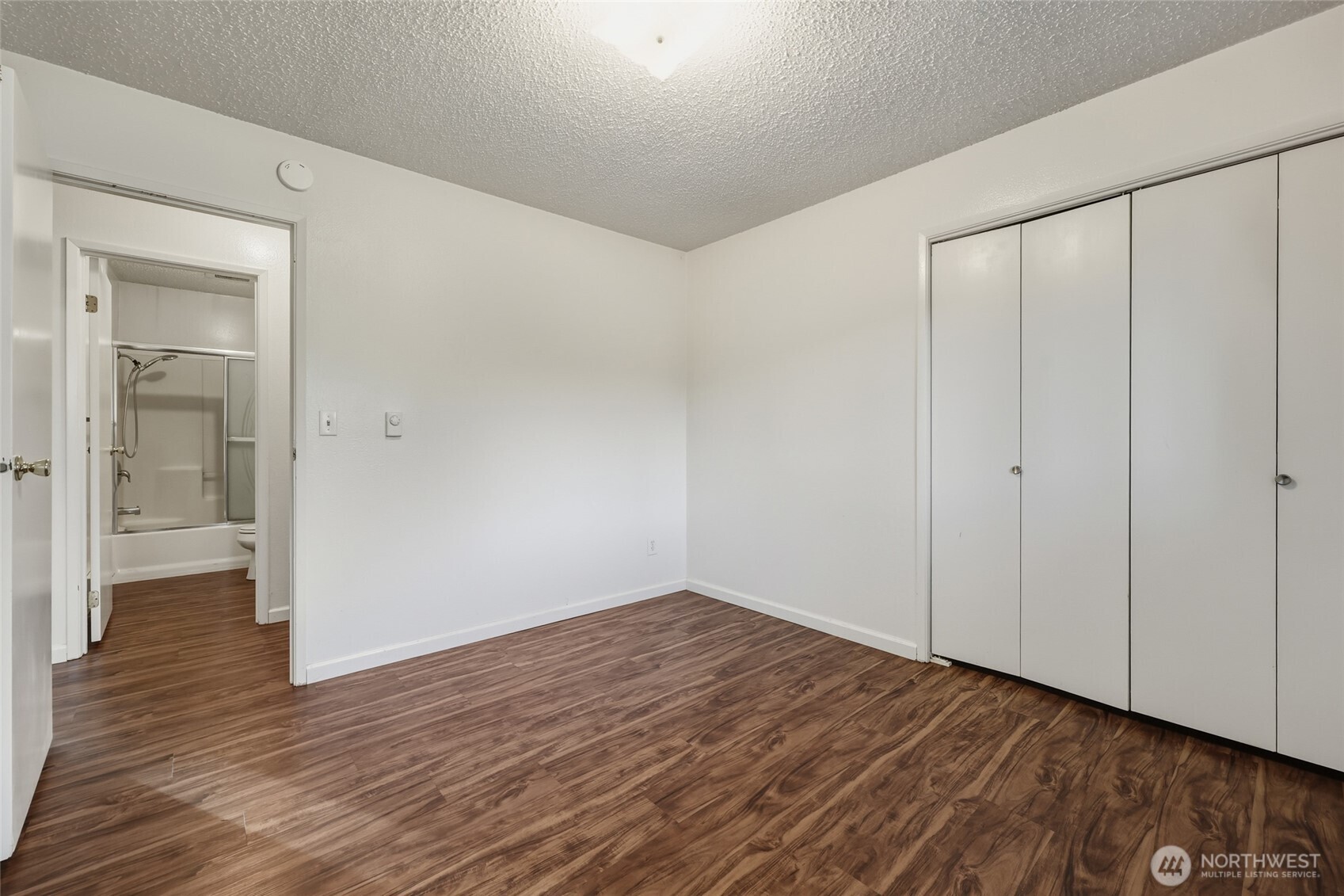 418 North 13th Street Elma, WA 98541 - Photo 13 of 34 a view of an empty room with wooden floor