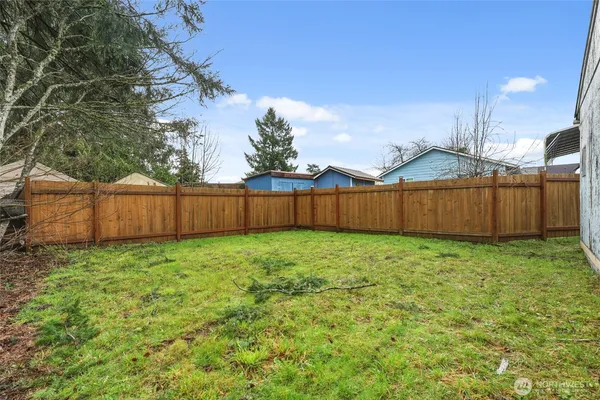an aerial view of a house with garden space and street view