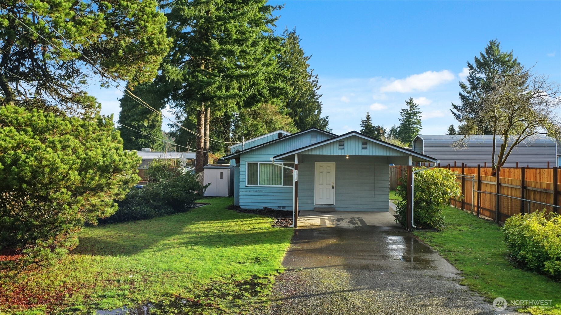 418 North 13th Street Elma, WA 98541 - Photo 30 of 37 a front view of a house with a garden
