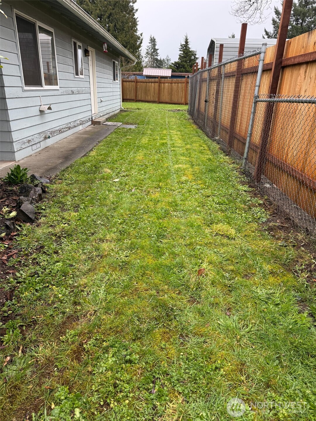 418 North 13th Street Elma, WA 98541 - Photo 4 of 37 a view of a backyard with a garden