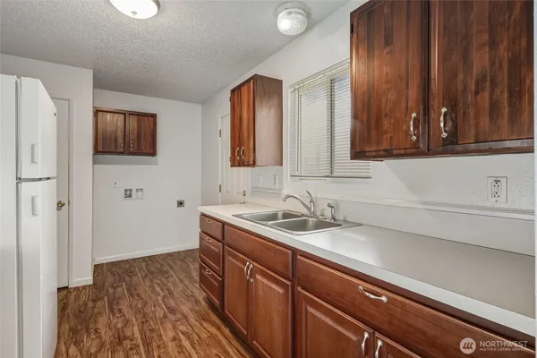 a kitchen with a sink and cabinets
