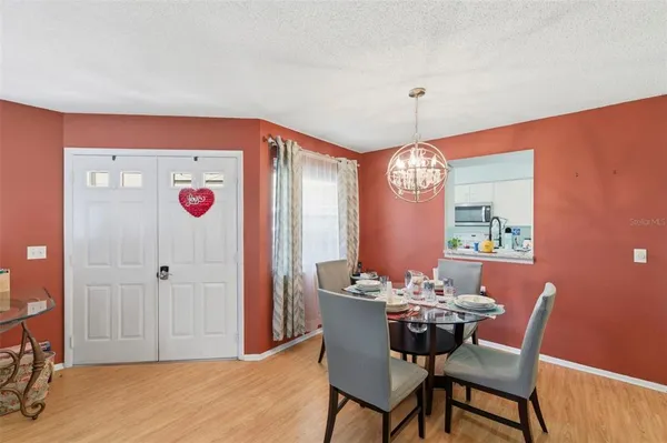 a kitchen with stainless steel appliances granite countertop a sink and a stove top oven