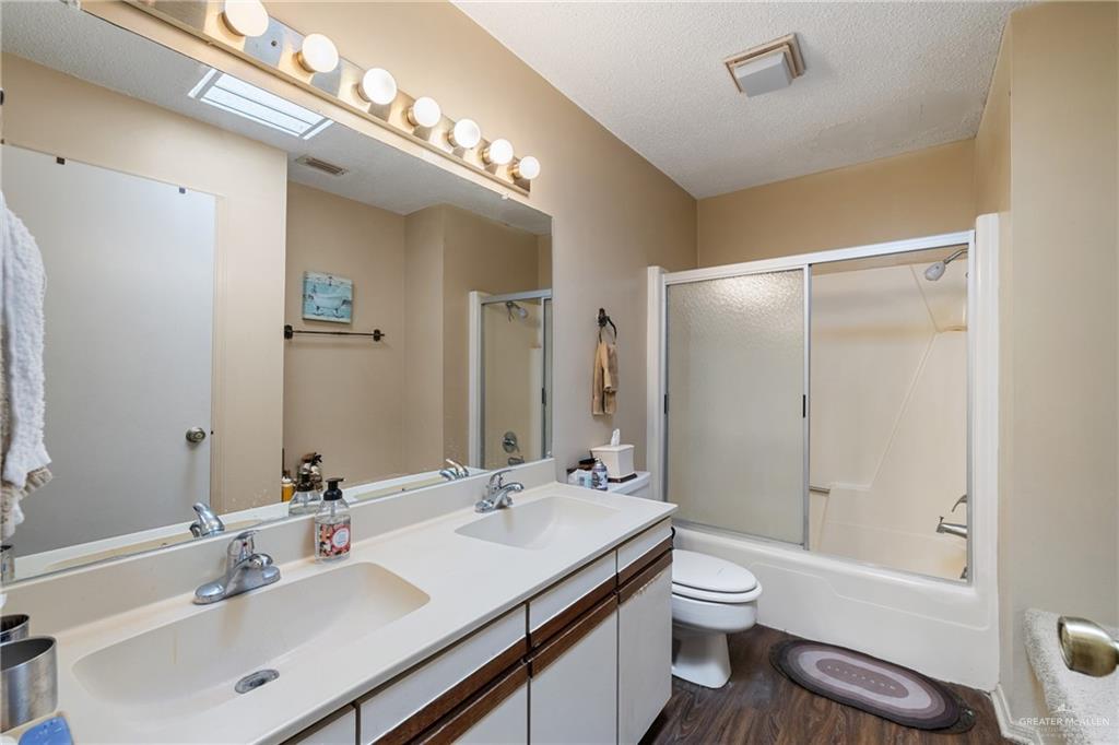 500 East El Rancho Avenue, Unit 22 McAllen, TX 78503 - Photo 13 of 17 a bathroom with a sink a toilet and shower