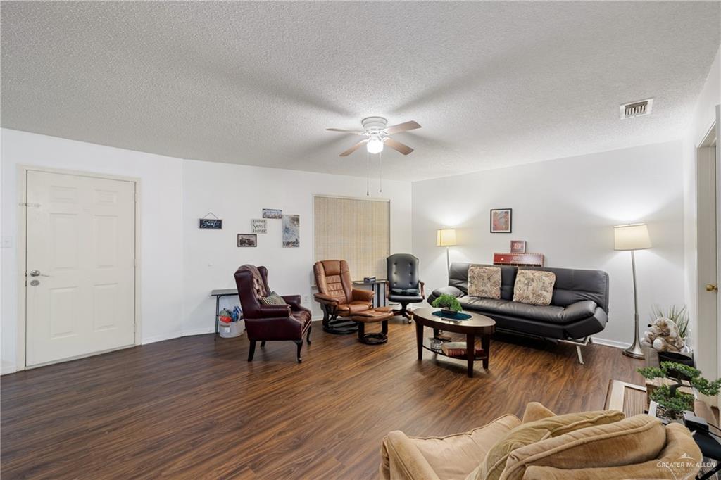 500 East El Rancho Avenue, Unit 22 McAllen, TX 78503 - Photo 7 of 17 a living room with furniture and wooden floor