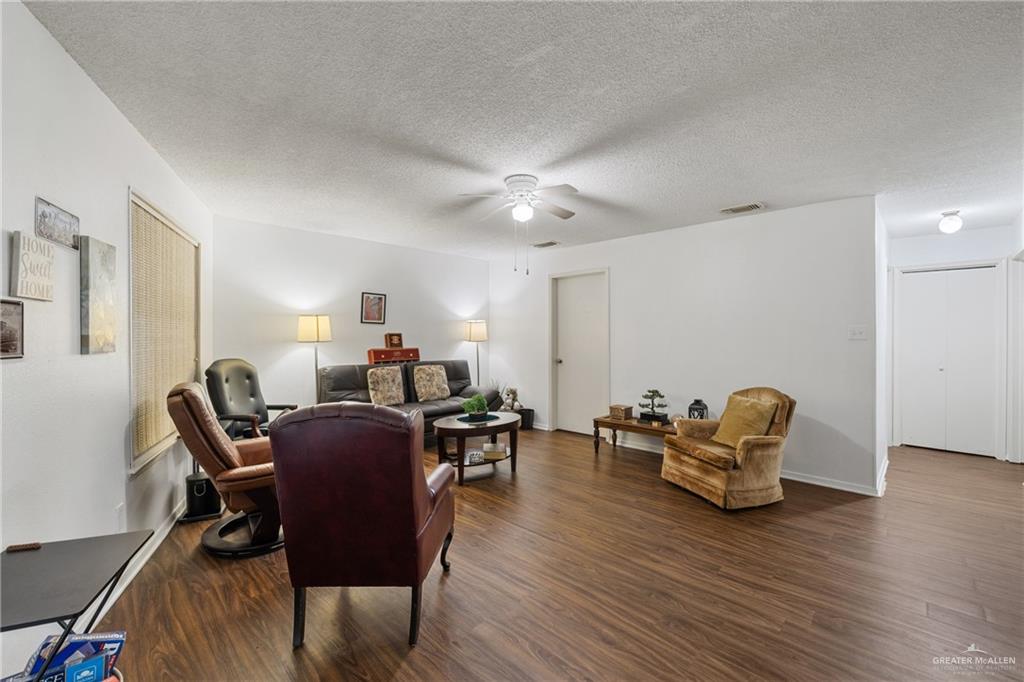 500 East El Rancho Avenue, Unit 22 McAllen, TX 78503 - Photo 8 of 17 a living room with furniture and a wooden floor