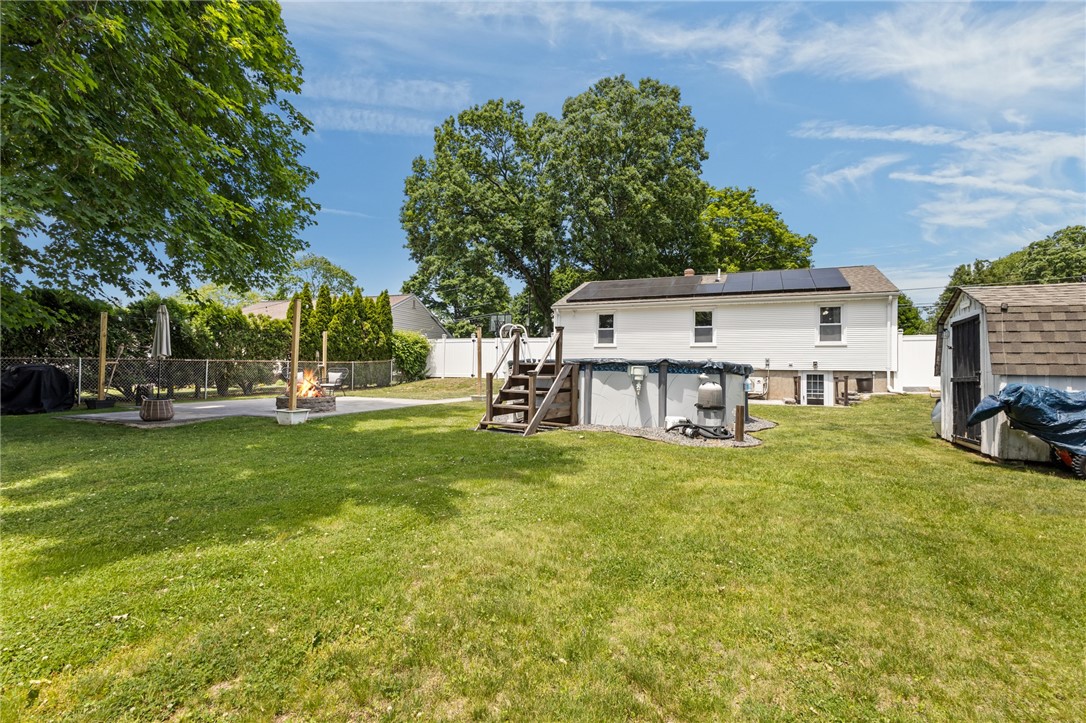 33 Fairhaven Road Cumberland, RI 02864 - Photo 30 of 36 Exterior rear with patio, pool and shed