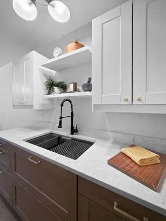 a kitchen with a sink and cabinets