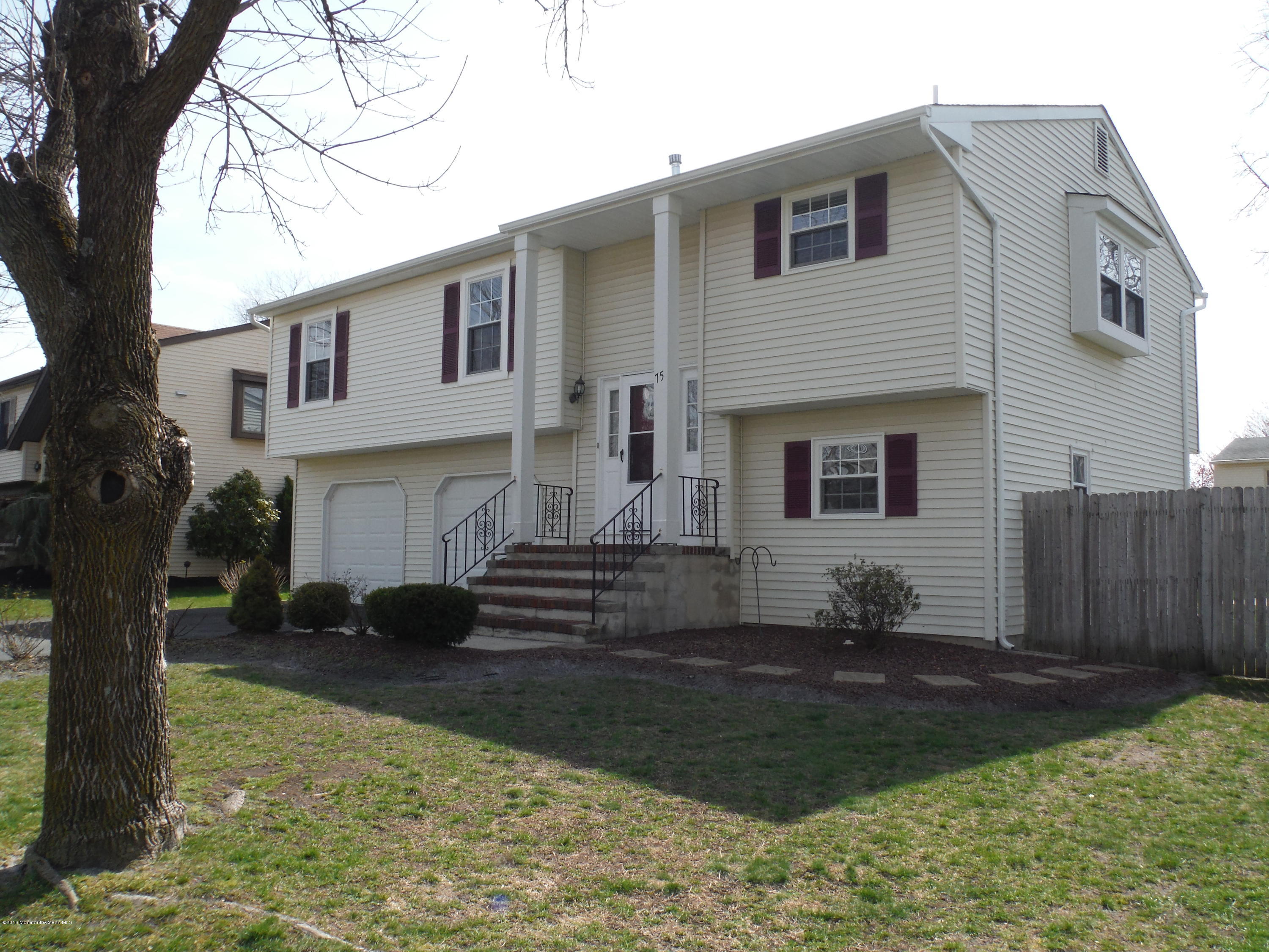 75 Appletree Road Howell, NJ 07731 - Photo 1 of 23 a front view of a house with a yard