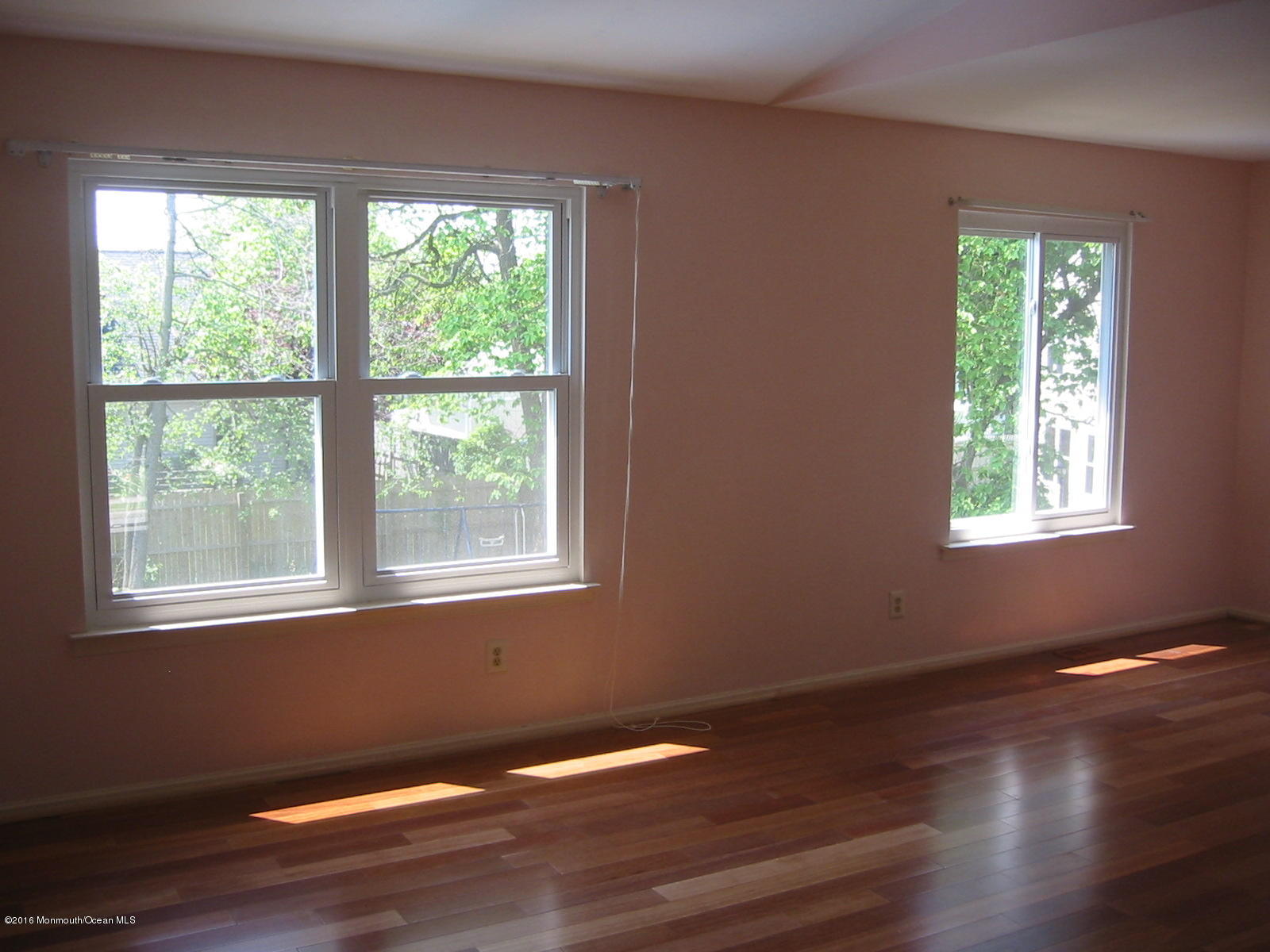 75 Appletree Road Howell, NJ 07731 - Photo 12 of 23 a view of an empty room with wooden floor and a window