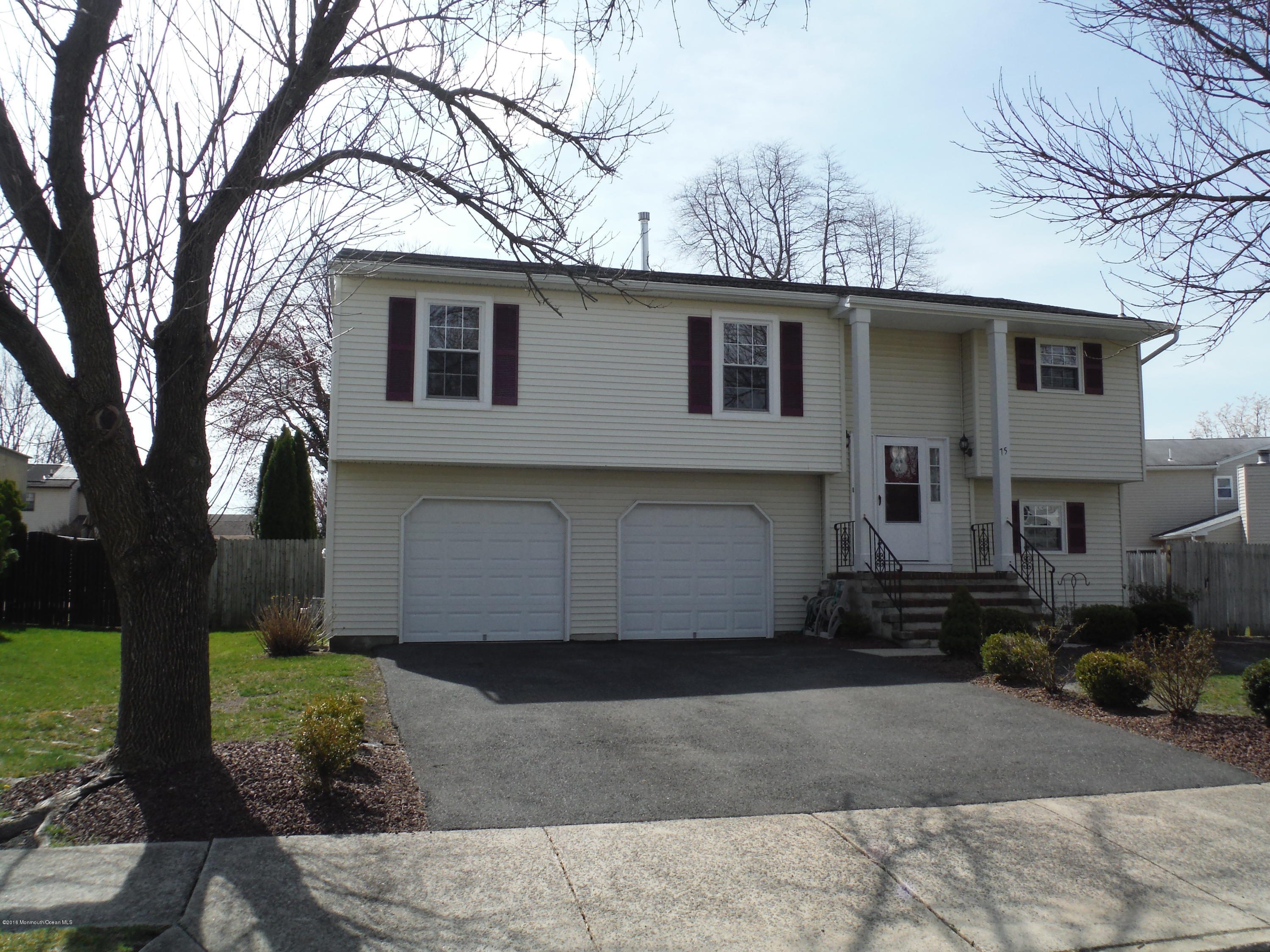 75 Appletree Road Howell, NJ 07731 - Photo 2 of 23 a front view of a house with garden