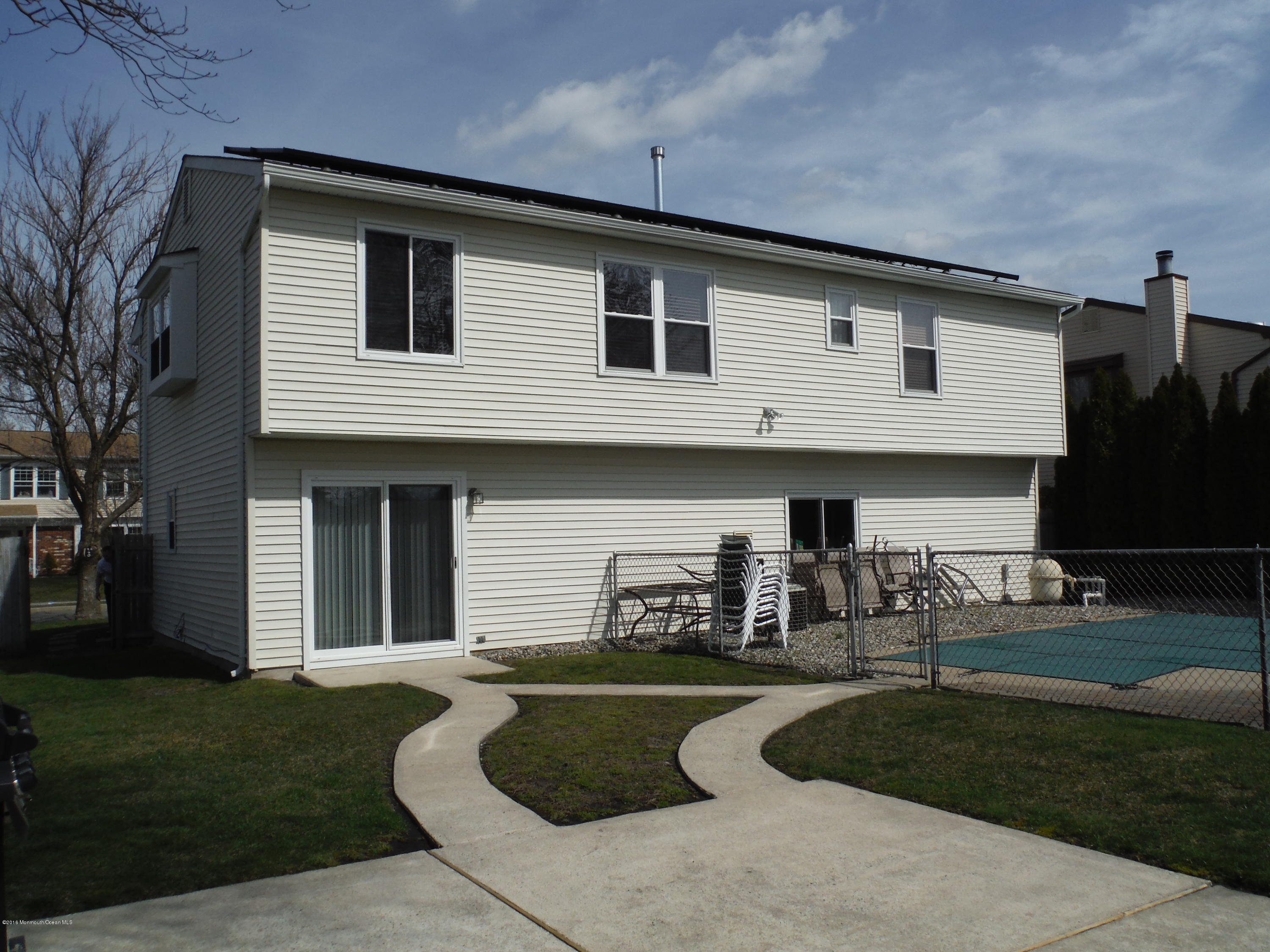 75 Appletree Road Howell, NJ 07731 - Photo 21 of 23 a front view of a house with a yard