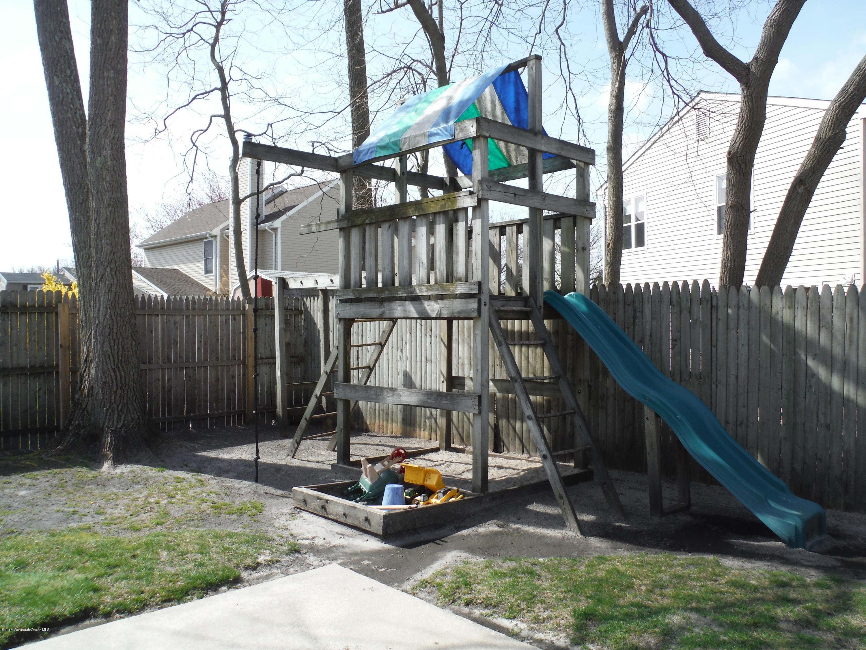 75 Appletree Road Howell, NJ 07731 - Photo 22 of 23 a view of a slide with a bench in patio