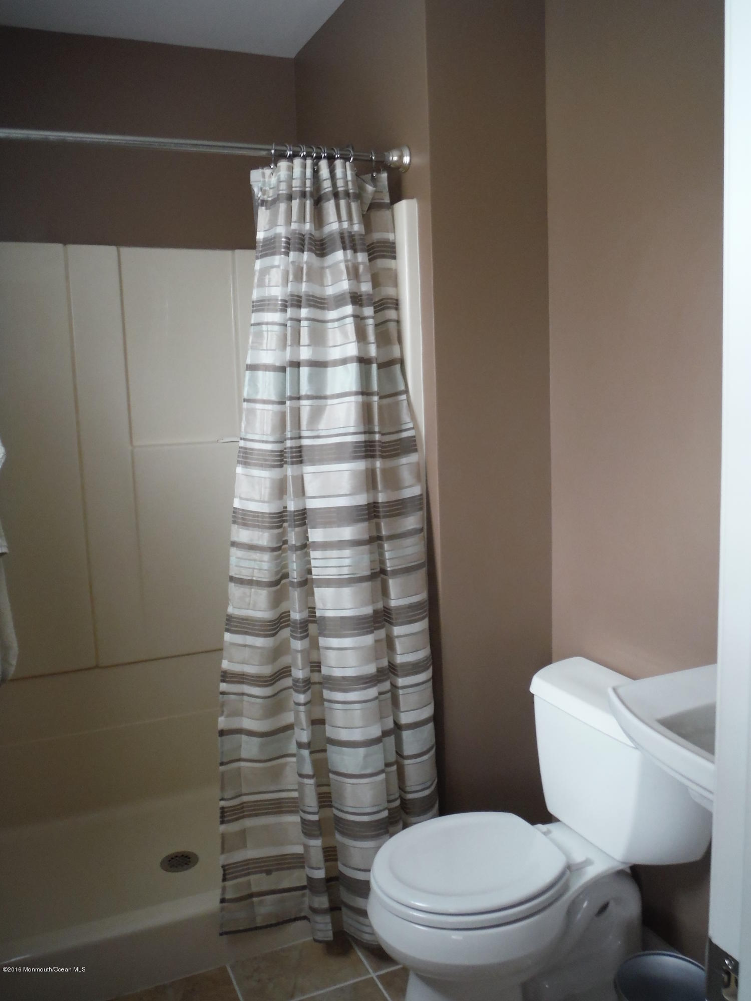 75 Appletree Road Howell, NJ 07731 - Photo 5 of 23 a bathroom with a toilet and a shower
