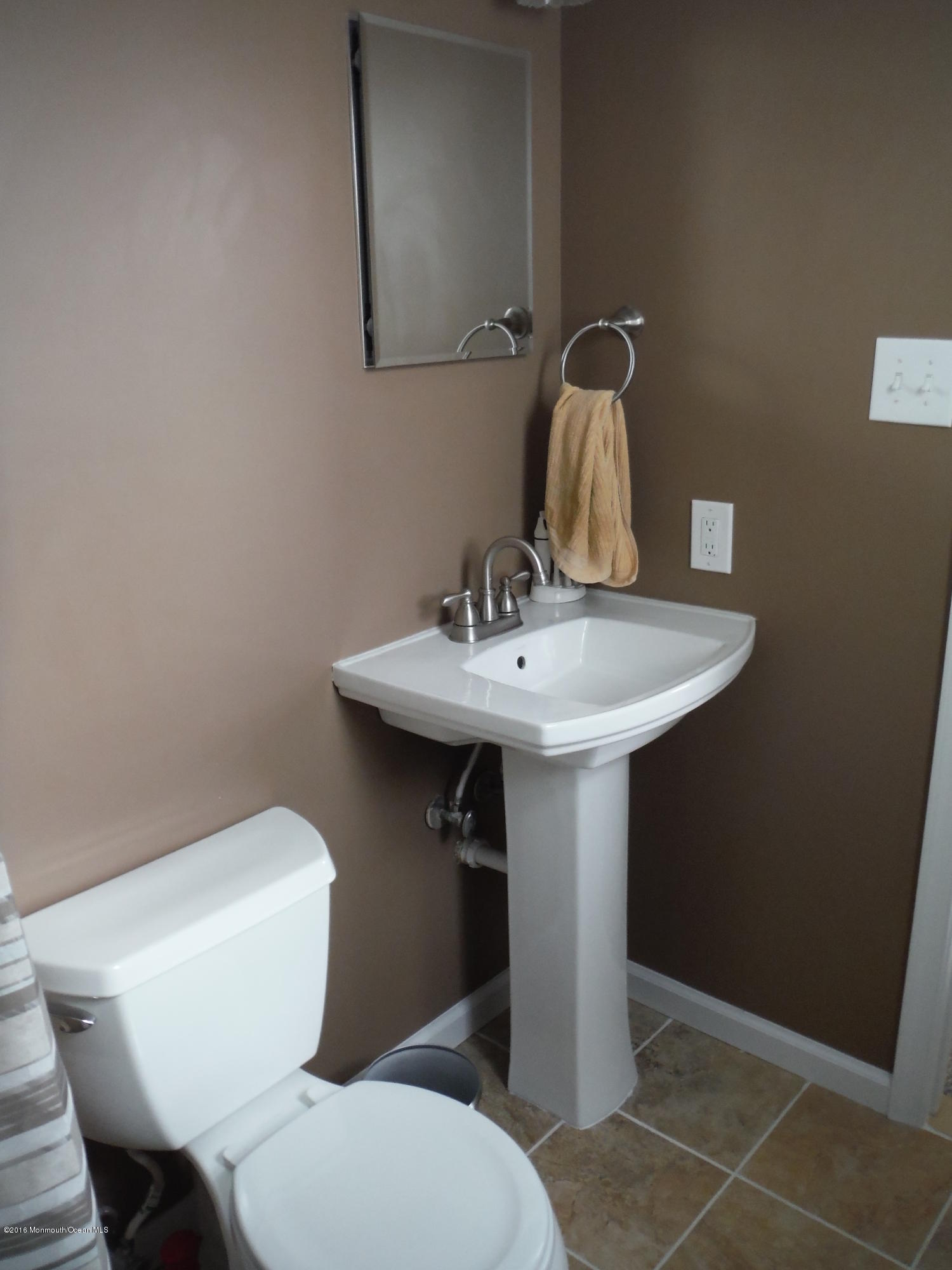 75 Appletree Road Howell, NJ 07731 - Photo 6 of 23 a bathroom with a sink toilet and a mirror