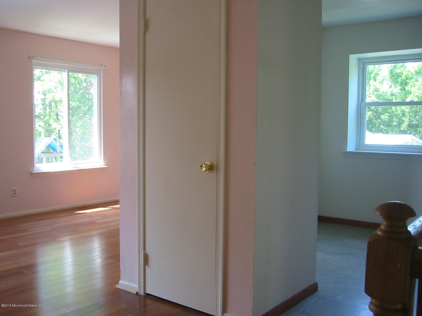 75 Appletree Road Howell, NJ 07731 - Photo 7 of 23 a view of hallway with hardwood floor and window