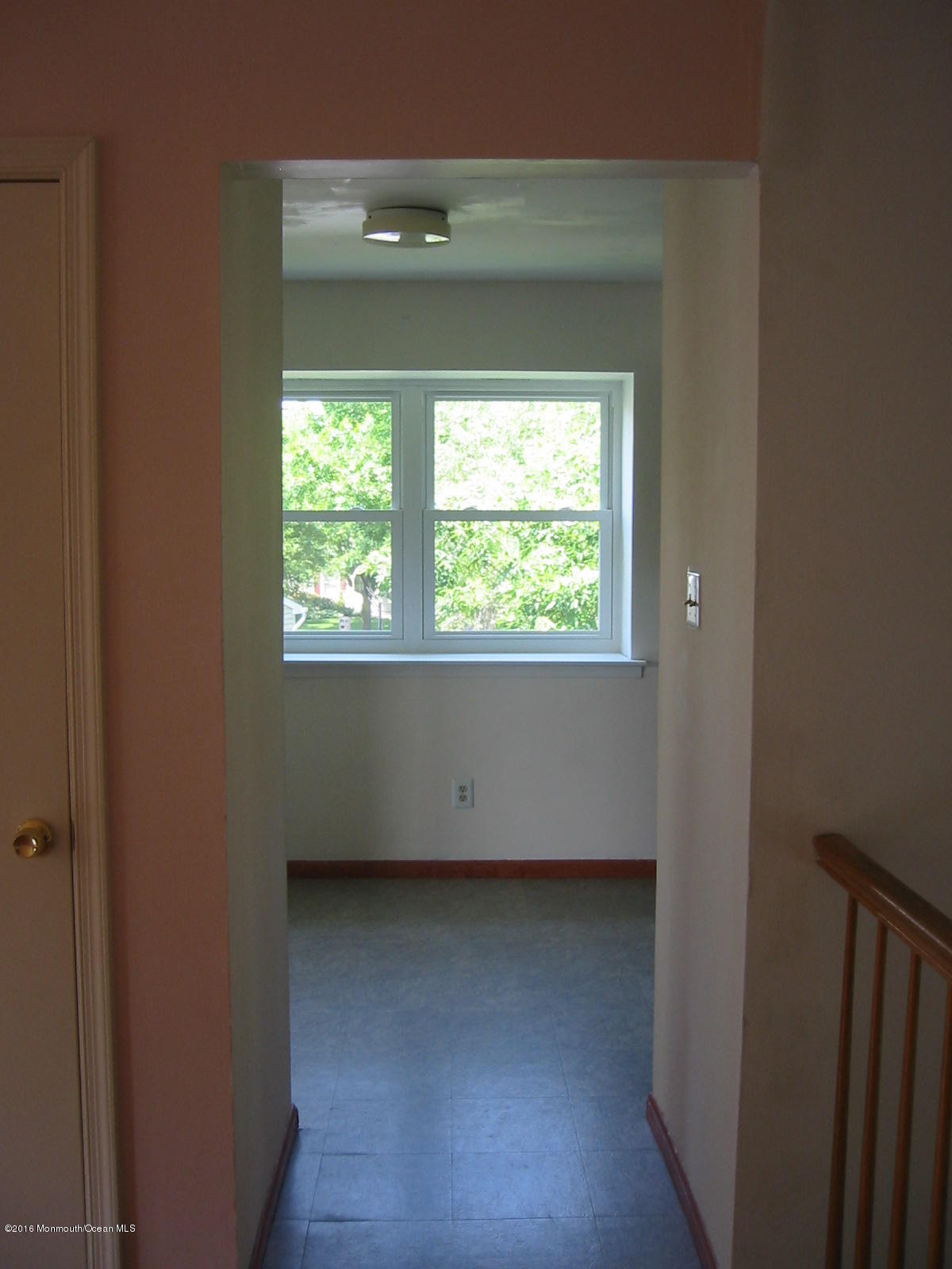 75 Appletree Road Howell, NJ 07731 - Photo 8 of 23 a view of an empty room with wooden floor and a window