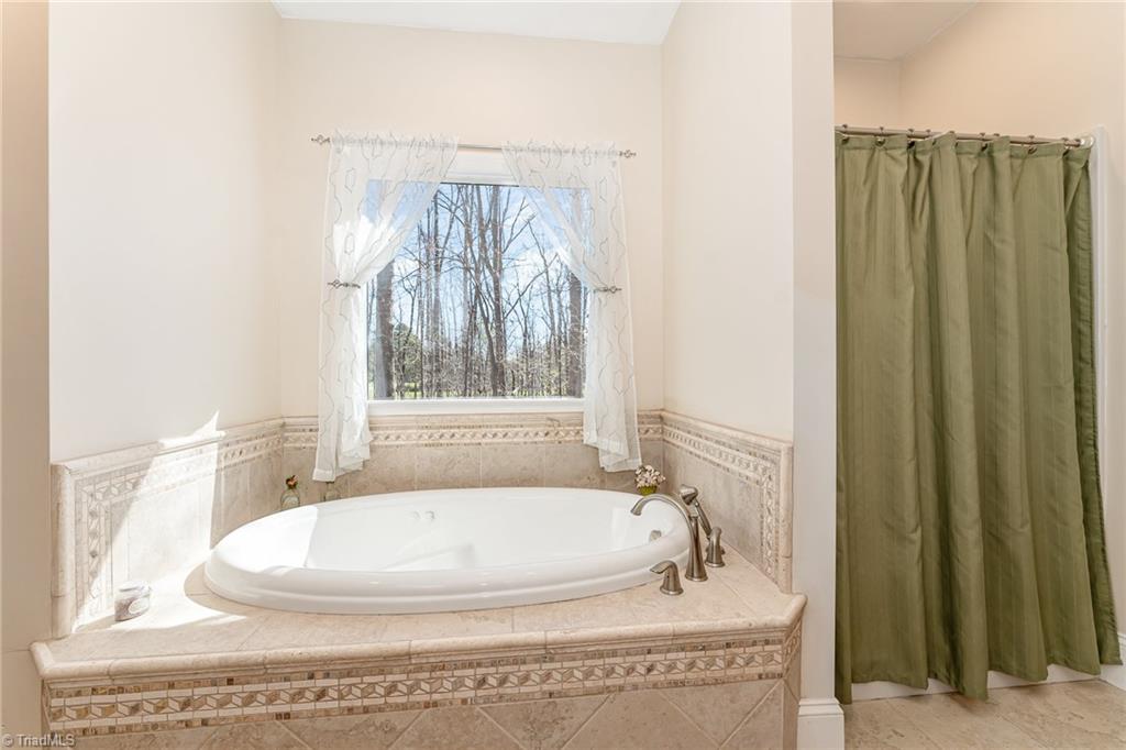5518 Watchtower Road Julian, NC 27283 - Photo 20 of 50 Garden tub and separate shower.