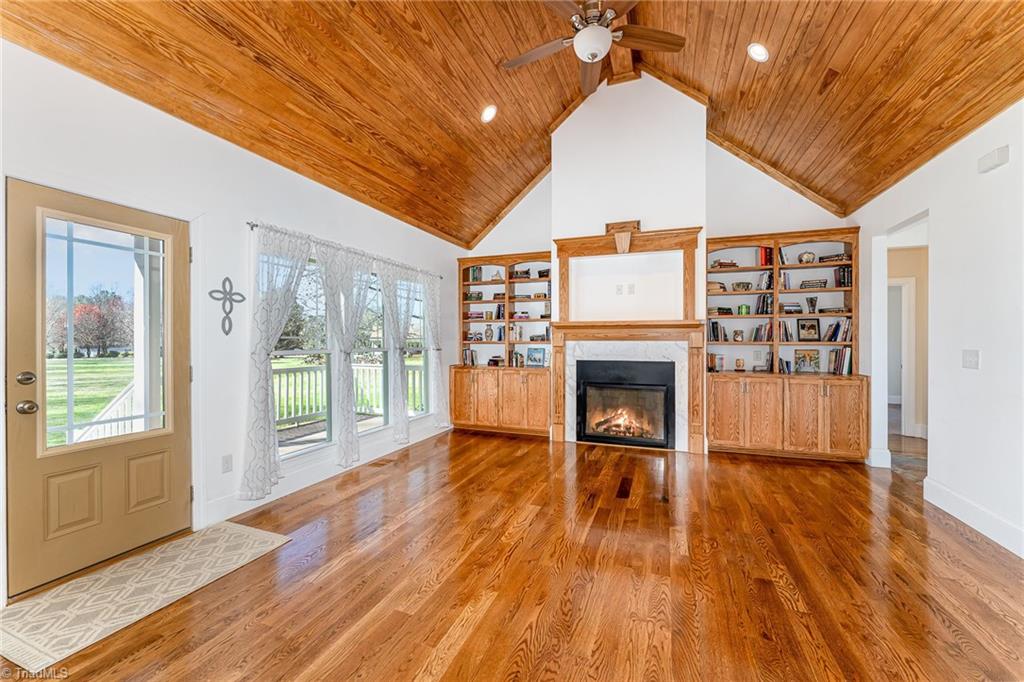 5518 Watchtower Road Julian, NC 27283 - Photo 10 of 50 Custom built-ins surround gas fireplace.