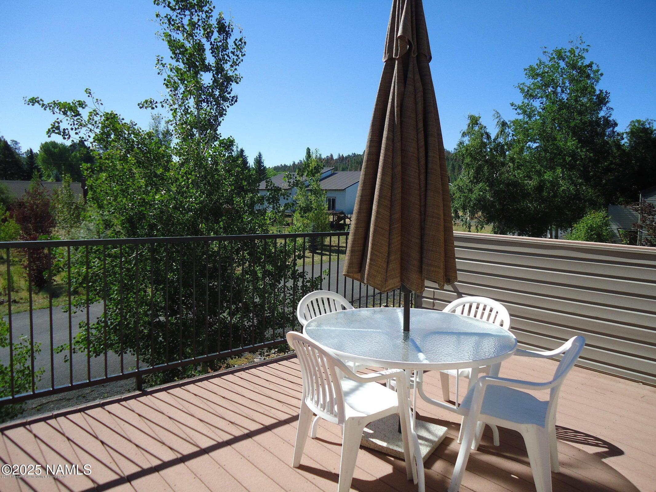 a table and chairs in a balcony