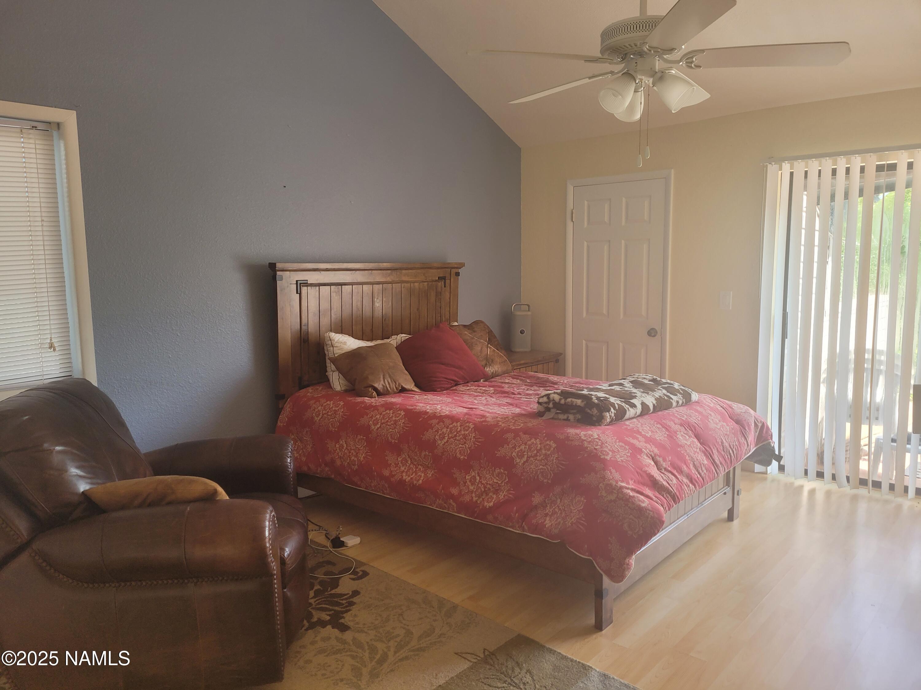 17980 Walapai Road, Unit 22B Munds Park, AZ 86017 - Photo 15 of 20 a bedroom with a bed couch and window