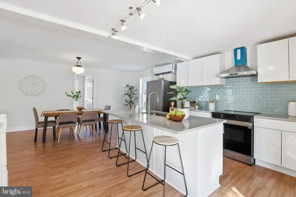 a view of front door with wooden floor