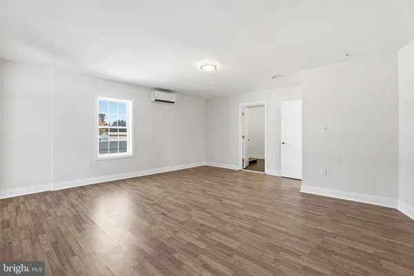a bathroom with a sink a toilet a mirror and shower