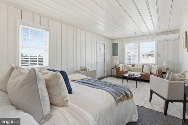 a bedroom with a bed and cabinets