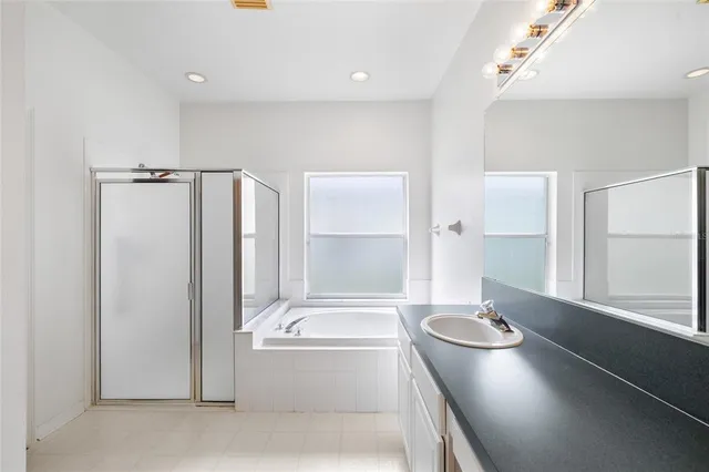 a view of a bathroom with a tub and a sink