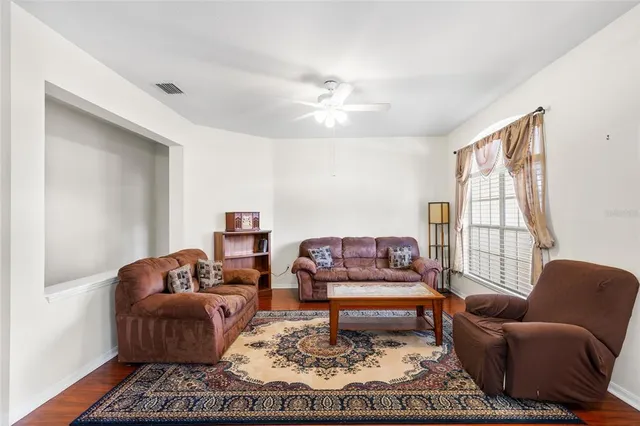 a living room with furniture or couch and a window