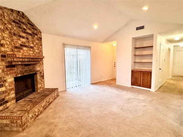 a view of a livingroom with a fireplace