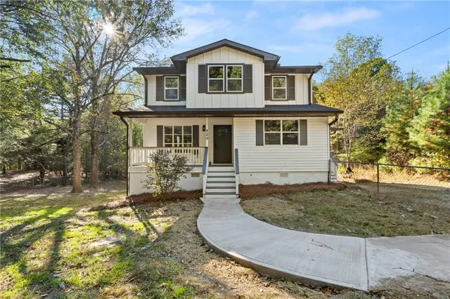 a front view of a house with garden