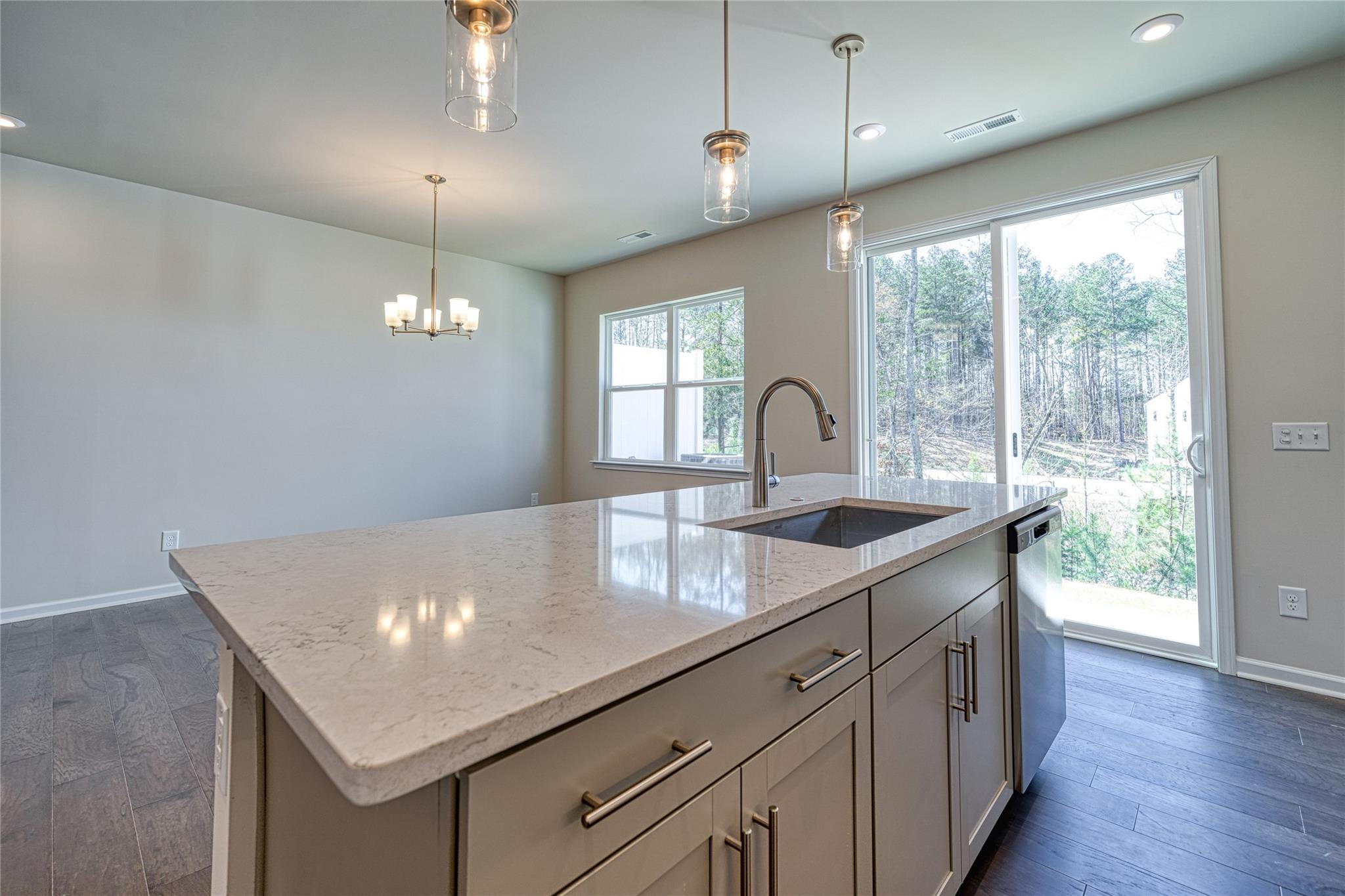 513 Madison Falls Court Fort Mill, SC 29708 - Photo 21 of 37 a kitchen with kitchen island a large island in it