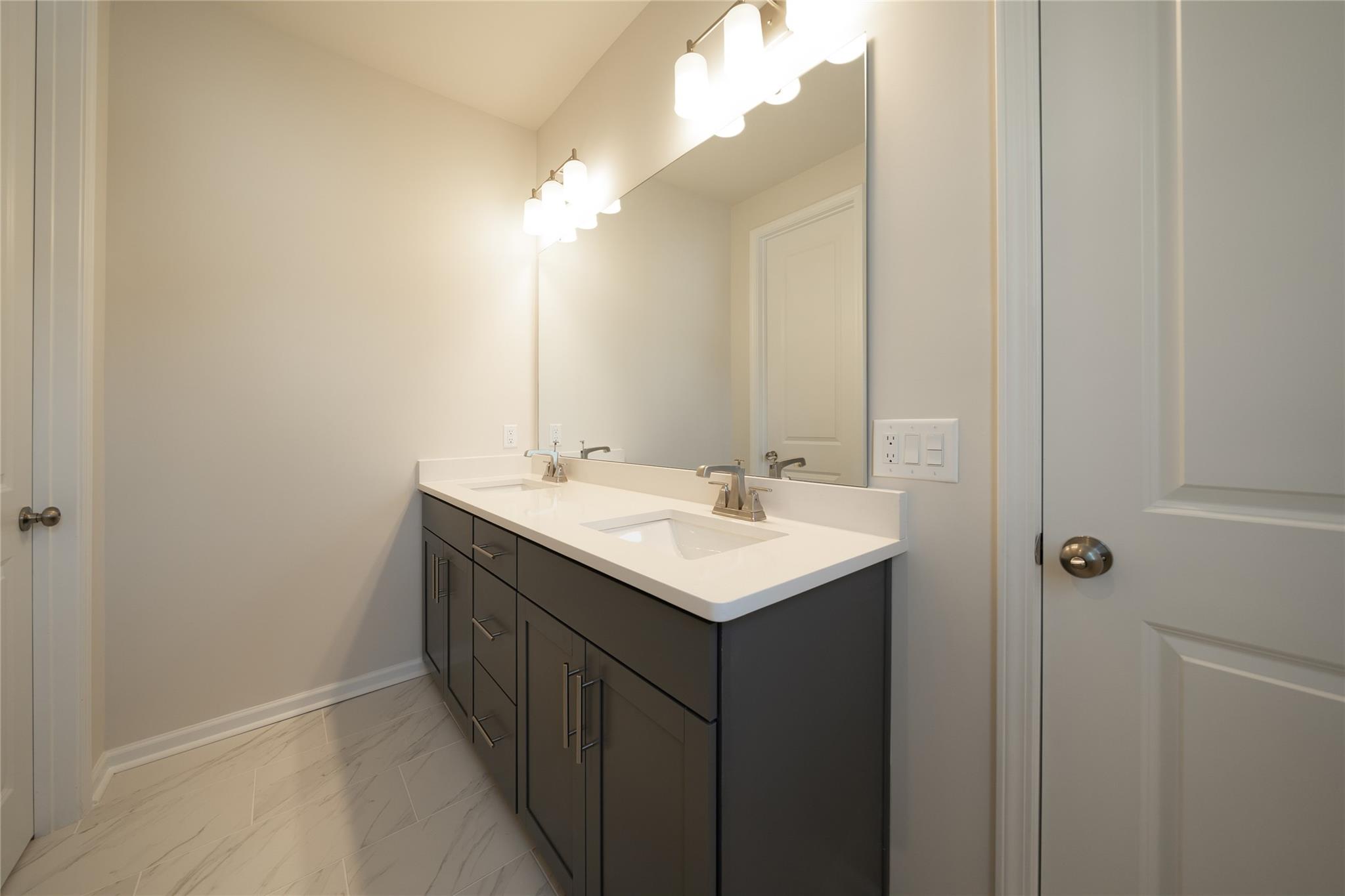 513 Madison Falls Court Fort Mill, SC 29708 - Photo 26 of 37 a bathroom with a sink and mirror