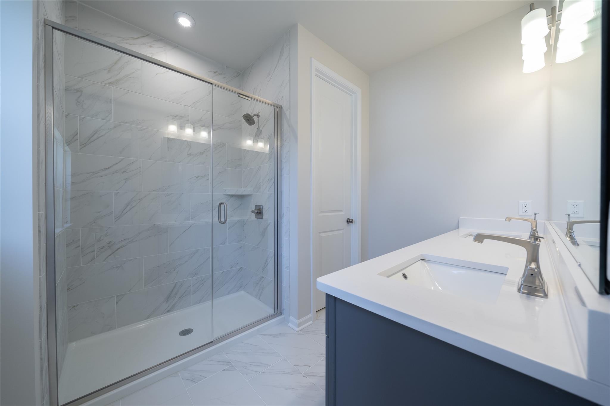 513 Madison Falls Court Fort Mill, SC 29708 - Photo 5 of 37 a bathroom with a sink and shower