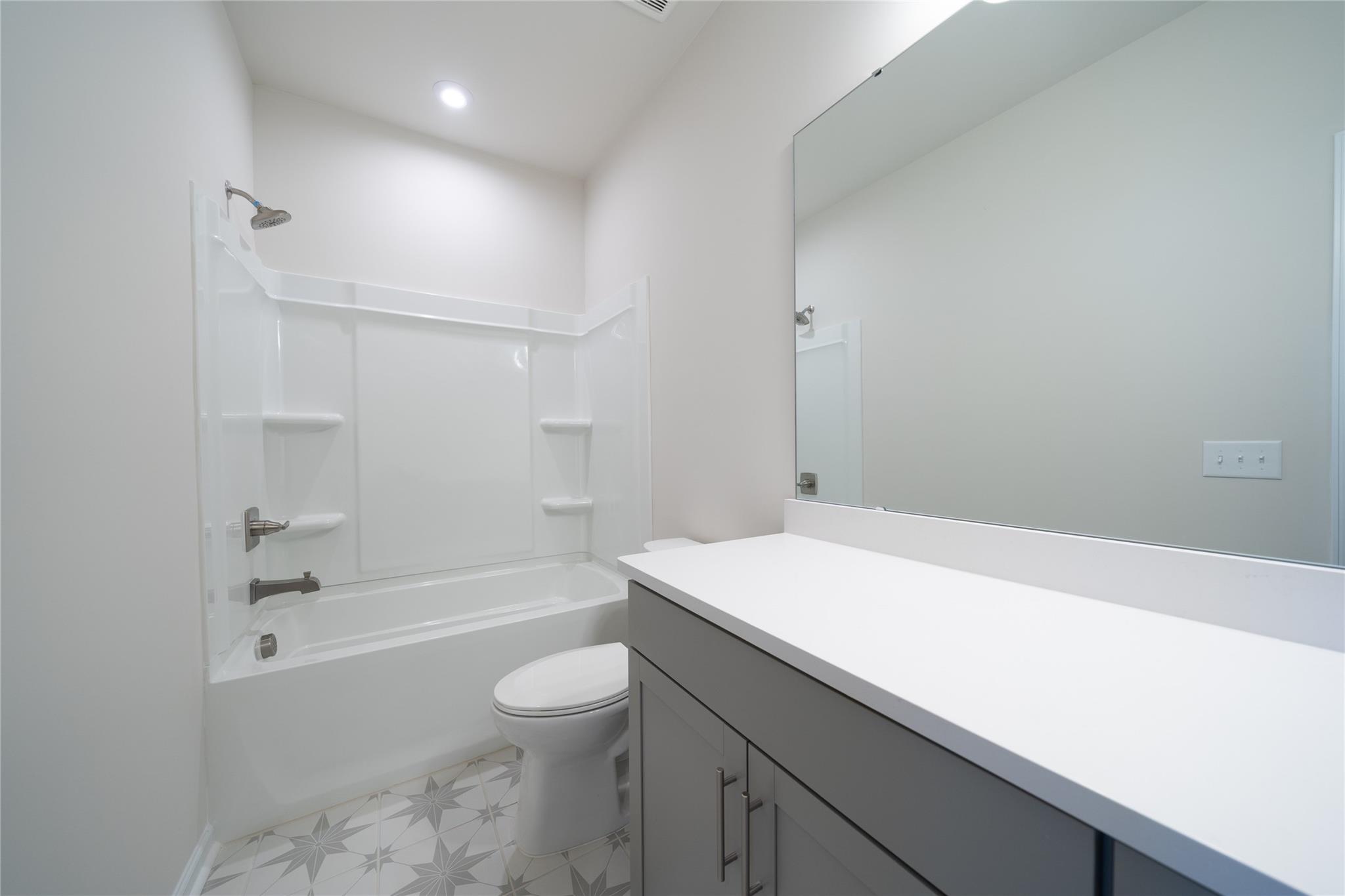 513 Madison Falls Court Fort Mill, SC 29708 - Photo 8 of 37 a bathroom with a sink a toilet and shower