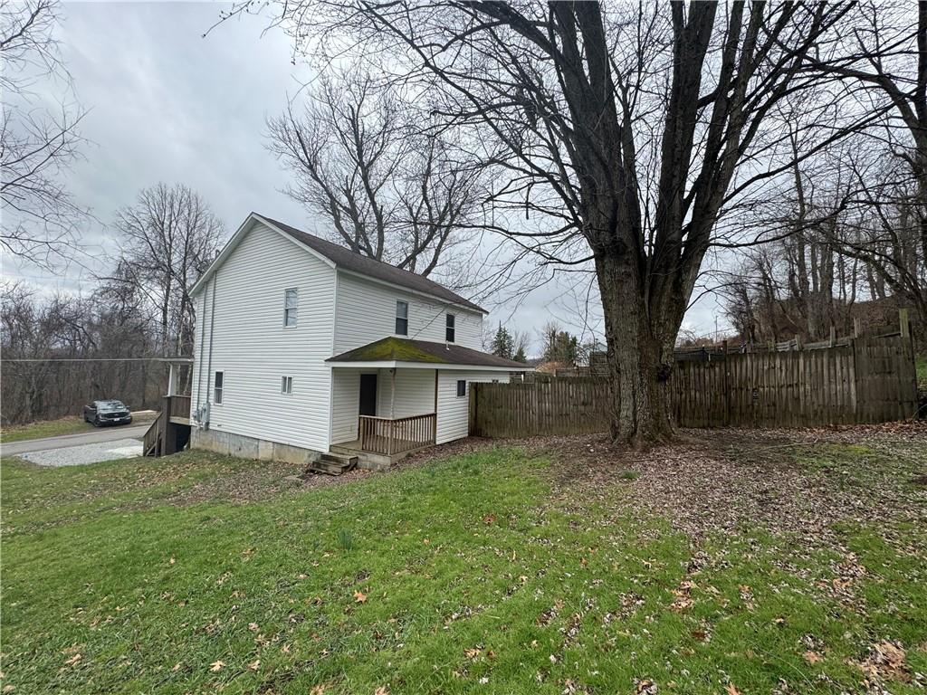 624 Main Street Merrittstown, PA 15463 - Photo 3 of 11 a white house that has a tree in front of it