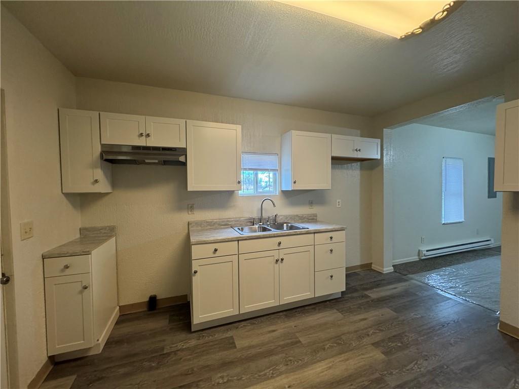 624 Main Street Merrittstown, PA 15463 - Photo 4 of 11 a kitchen with stainless steel appliances granite countertop a sink a stove a refrigerator and cabinets