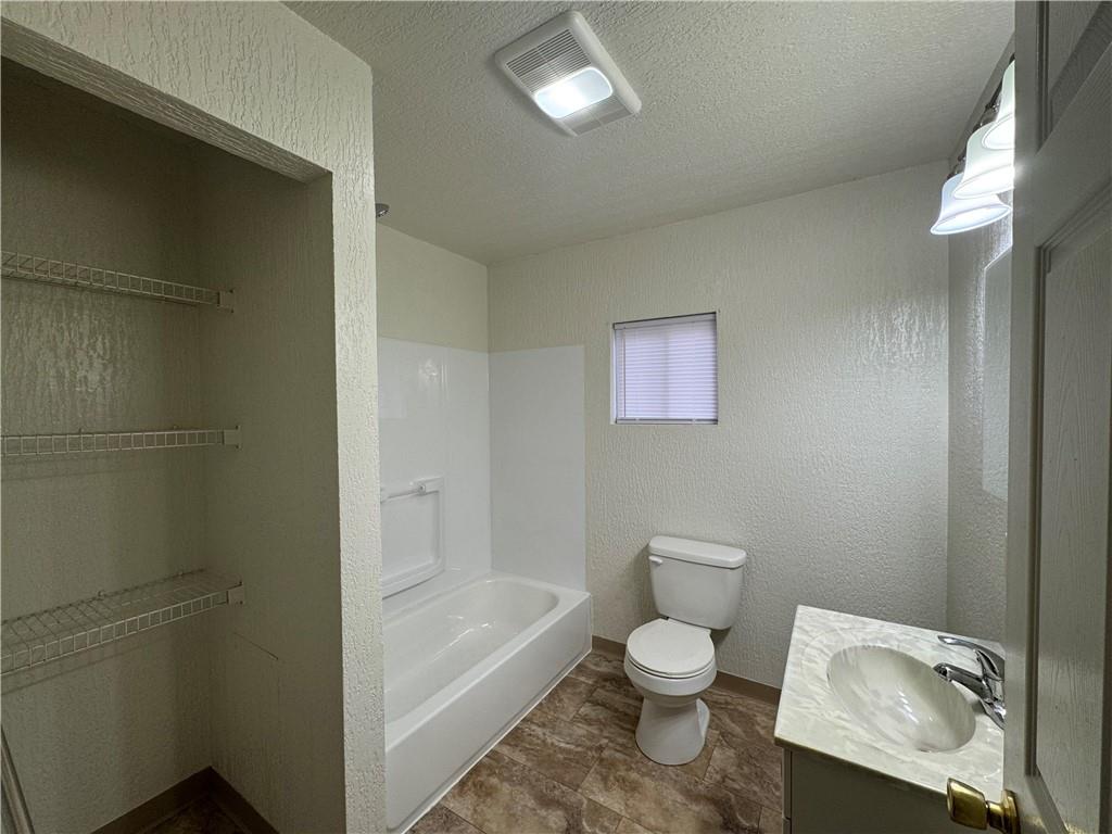 624 Main Street Merrittstown, PA 15463 - Photo 6 of 11 a bathroom with a toilet a sink and bathtub