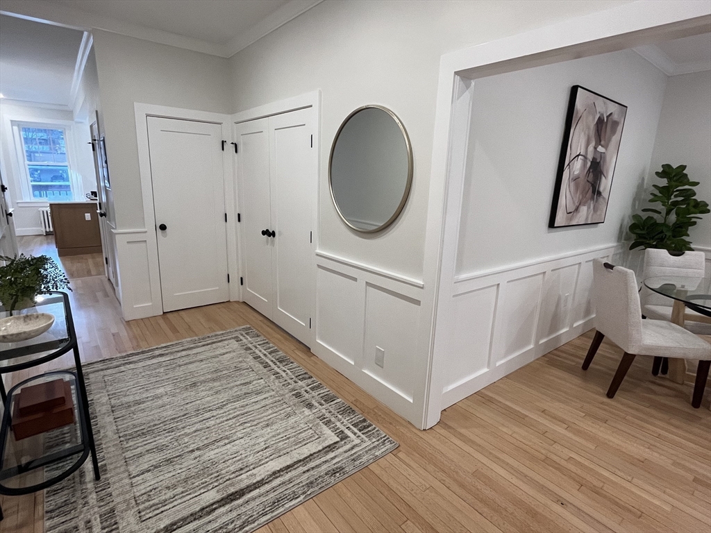 108 St Paul Street, Unit 2 Brookline, MA 02446 - Photo 5 of 15 a view of a livingroom with wooden floor and furniture