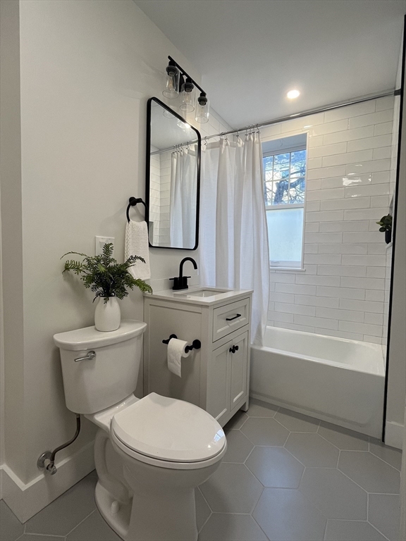 108 St Paul Street, Unit 2 Brookline, MA 02446 - Photo 9 of 15 a bathroom with a sink toilet and shower