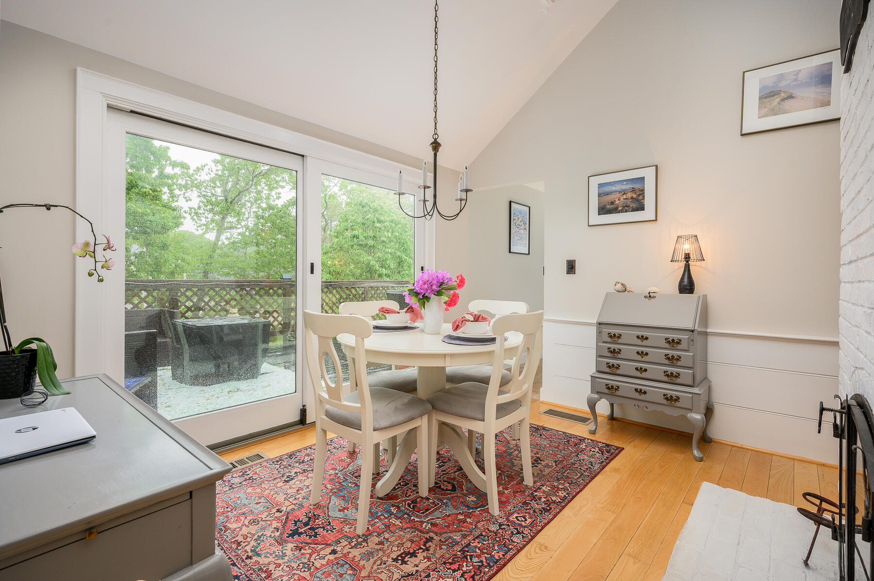 20 Squirrel Run Eastham, MA 02642 - Photo 13 of 37 a dining room with furniture a chandelier and wooden floor