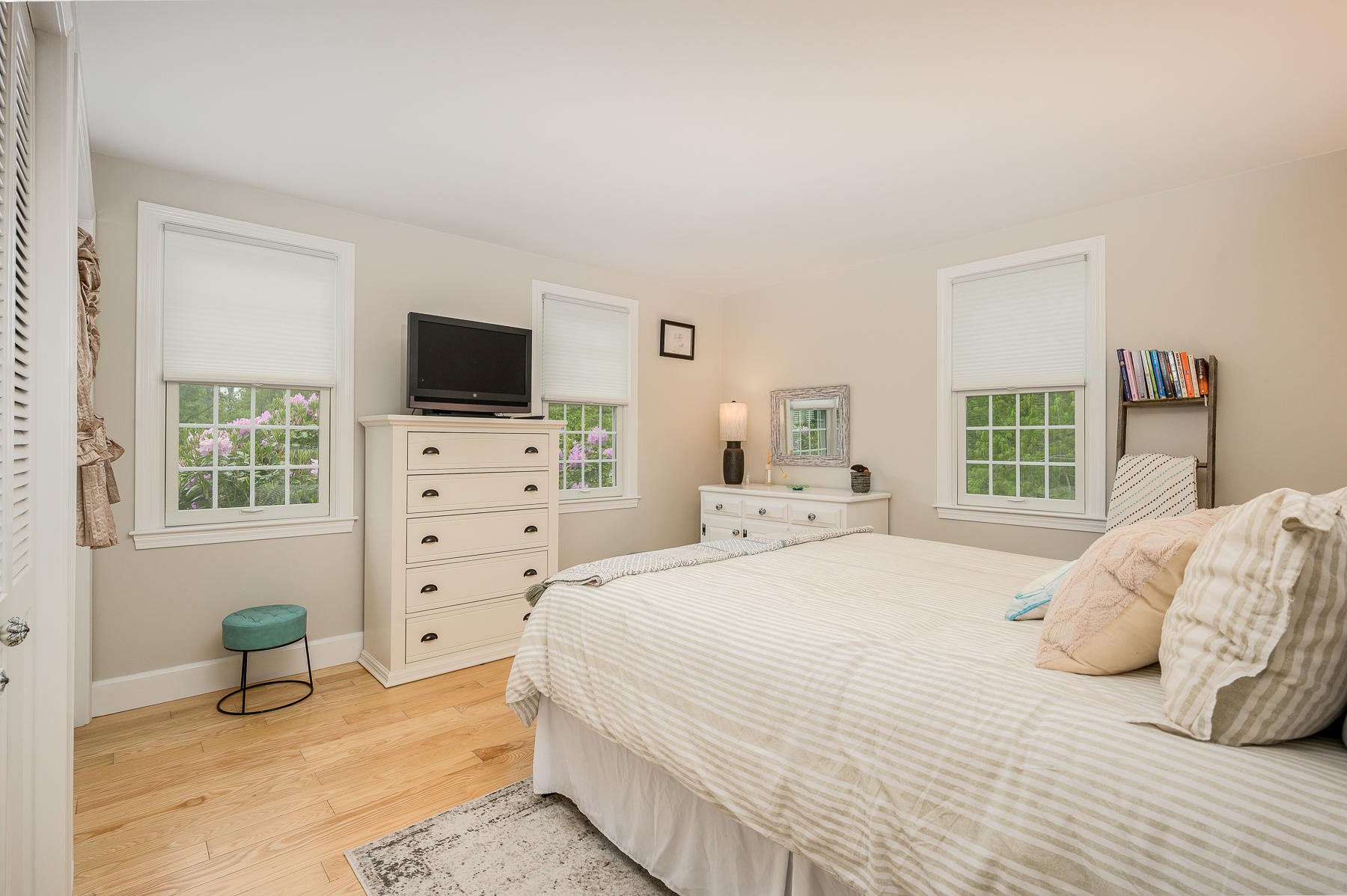 20 Squirrel Run Eastham, MA 02642 - Photo 15 of 37 a bedroom with a bed and a flat screen tv